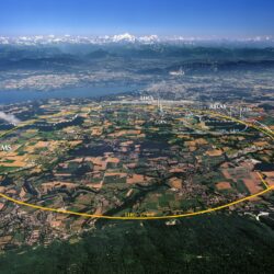 Figure 1: Aerial view of the 27-kilometer-long Large Hadron Collider (LHC) located on the border of France and Switzerland near Geneva. The LHC collides particles at nearly the speed of light to study the universe in a controlled experimental facility. The Higgs boson was discovered with the LHC in 2012. Image credit to ESO Supernova.
